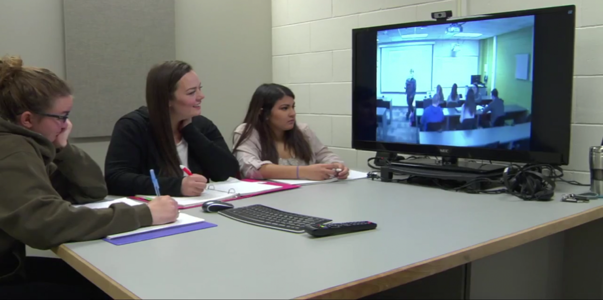 Group of students watching virtual class