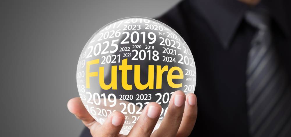 Hand holding a ball that says "Future" 