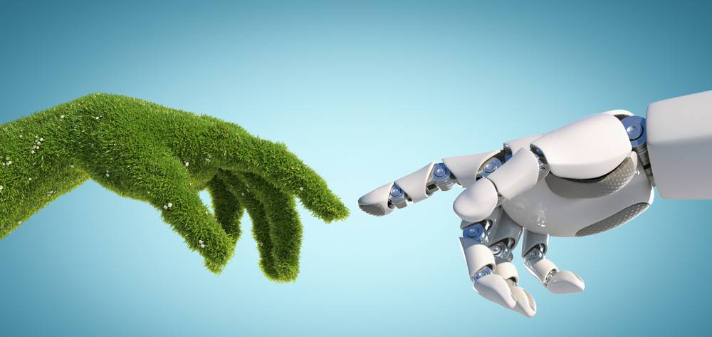 Robot and grass hands pointing index finger toward each other 