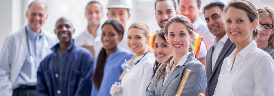 A group of professionals smiling at the camera