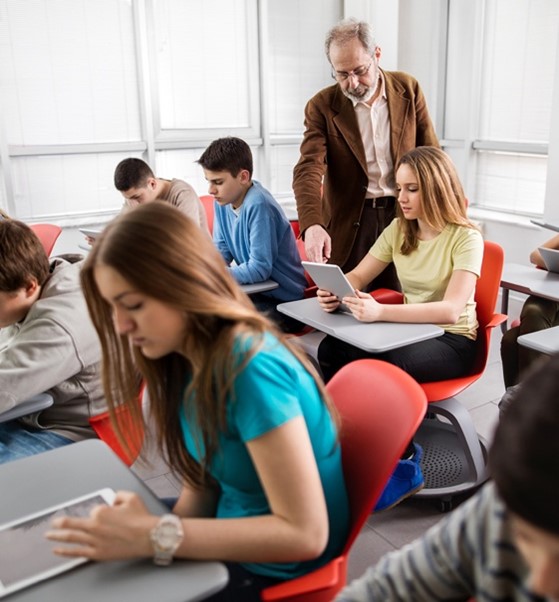 Students in a classroom with tablets