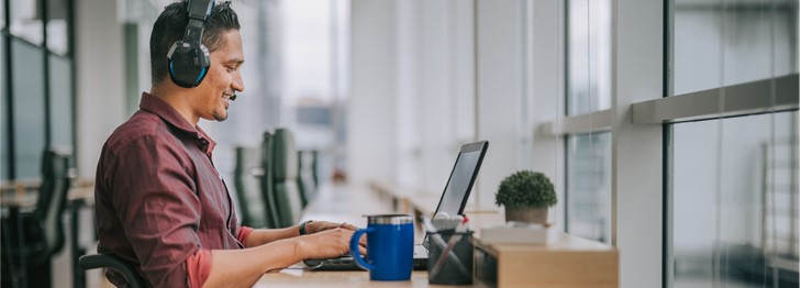 Person with a headset and laptop