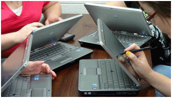 Group of students using tablets in class