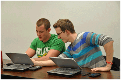 Two students using tablets in class