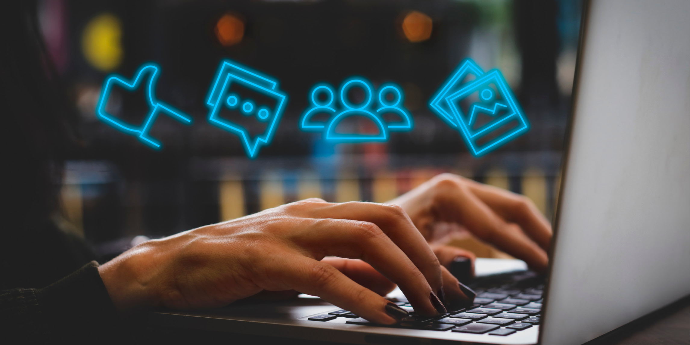 Person typing on keyboard with icons displaying over their hands