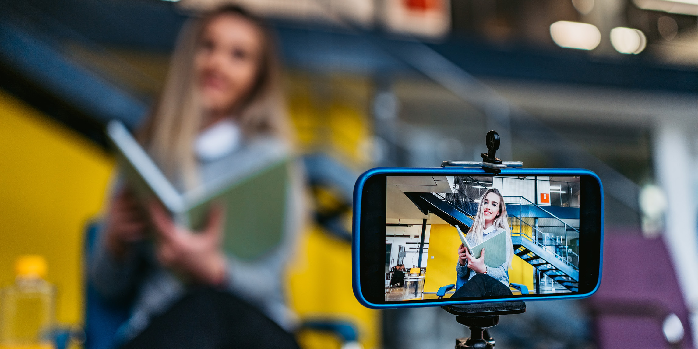 A woman recording a video with her smart phone