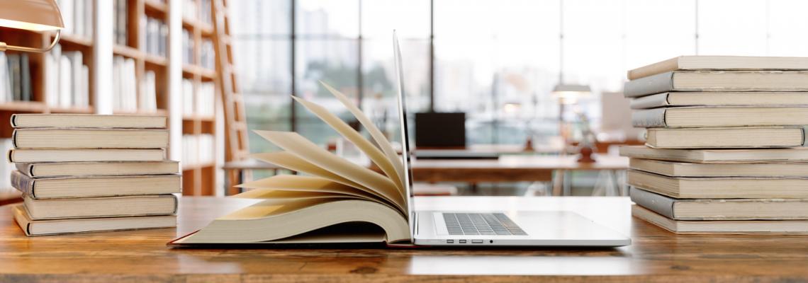 1140x400-laptop-books-library