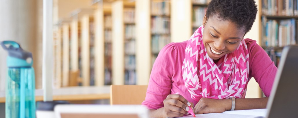 A person writing in a notebook