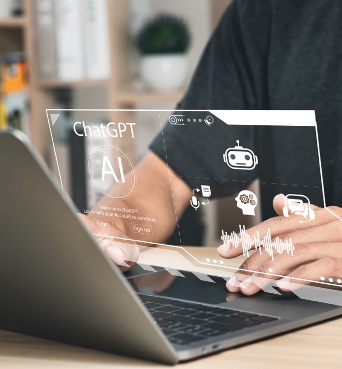 A person with ChatGPT on their laptop