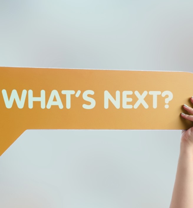 What is next written on a sign